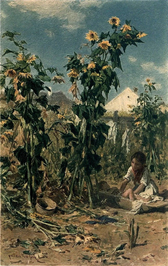 Il bambino al riparo sotto i girasoli